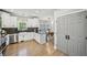 Well-equipped kitchen adjacent to sunlit dining room with stainless appliances at 2810 Burgundy Dr, Cumming, GA 30041