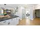 Open living space adjacent to the kitchen with stainless appliances at 2810 Burgundy Dr, Cumming, GA 30041