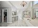 A relaxing main bathroom suite features a soaking tub, glass shower, chandelier, and a double vanity sink at 2810 Burgundy Dr, Cumming, GA 30041