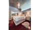 Well-lit bedroom boasts hardwood floors, mirrored closet, and hanging light fixture at 3324 Peachtree Ne Rd # 1116, Atlanta, GA 30326