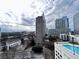 Expansive city view featuring a rooftop pool and high-rise buildings at 3324 Peachtree Ne Rd # 1116, Atlanta, GA 30326