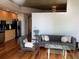 Modern living room featuring hardwood floors and gray sofa at 3324 Peachtree Ne Rd # 1116, Atlanta, GA 30326