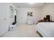 Bright bedroom boasts neutral carpet, white walls, and classic furnishings for a cozy, inviting space at 5440 Shady Grove Rd, Cumming, GA 30041
