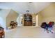Spacious bonus room featuring neutral walls, plush carpeting, and built-in shelving unit at 5440 Shady Grove Rd, Cumming, GA 30041
