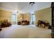 Large bonus room with neutral walls, plush carpeting and a desk by the window at 5440 Shady Grove Rd, Cumming, GA 30041