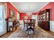 Elegant dining room with a chandelier, a large wooden table, and decorative furnishings for formal meals at 5440 Shady Grove Rd, Cumming, GA 30041
