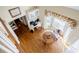 Open foyer featuring hardwood floors and an office area, bathed in natural light at 5440 Shady Grove Rd, Cumming, GA 30041