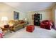 Inviting living room with comfortable seating, a decorative cabinet, and soft lighting for relaxation at 5440 Shady Grove Rd, Cumming, GA 30041