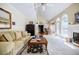 Inviting living room with tall ceilings, large windows, and a view into the adjacent dining area at 5440 Shady Grove Rd, Cumming, GA 30041