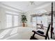 Bright main bedroom featuring ample natural light, tray ceilings, and a tranquil atmosphere at 5440 Shady Grove Rd, Cumming, GA 30041
