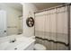 Bathroom with shower, toilet, sink, vanity, and decorative shelves at 6065 Nw Gentlewind Court Nw Ct, Powder Springs, GA 30127