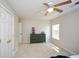 Clean bedroom featuring a dresser, window, and closet at 6065 Nw Gentlewind Court Nw Ct, Powder Springs, GA 30127