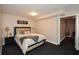 Cozy bedroom featuring furniture, light fixtures, and attached room at 6065 Nw Gentlewind Court Nw Ct, Powder Springs, GA 30127