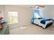 Bright bedroom with natural light and window with bed and furniture at 6065 Nw Gentlewind Court Nw Ct, Powder Springs, GA 30127