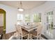 Cozy dining area featuring bright windows and a farmhouse-style table for casual meals at 6065 Nw Gentlewind Court Nw Ct, Powder Springs, GA 30127