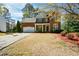 Charming two-story brick home with a well-manicured lawn and attached garage at 6065 Nw Gentlewind Court Nw Ct, Powder Springs, GA 30127