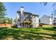 Charming home showcasing a spacious backyard, a wooden deck, and mature trees, offering a private outdoor retreat at 6065 Nw Gentlewind Court Nw Ct, Powder Springs, GA 30127