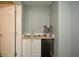 Wet bar kitchenette featuring refrigerator, sink and plenty of cabinet storage at 6065 Nw Gentlewind Court Nw Ct, Powder Springs, GA 30127