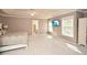 Spacious main bedroom with neutral carpet, en-suite bathroom, and windows for natural light at 6065 Nw Gentlewind Court Nw Ct, Powder Springs, GA 30127