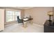 Home office with large window offering natural light, perfect for working from home at 6065 Nw Gentlewind Court Nw Ct, Powder Springs, GA 30127
