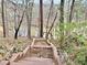 Backyard featuring wooden stairs leading down to a private dock on the lake at 89 Paces Lakes Pt, Dallas, GA 30157