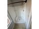 Bathroom with a white shower stall and light tile flooring at 89 Paces Lakes Pt, Dallas, GA 30157