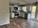 Modern kitchen with stainless steel appliances, white cabinets, and hardwood floors at 89 Paces Lakes Pt, Dallas, GA 30157