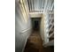 Carpeted staircase leading to the basement with white railings and wood trim at 89 Paces Lakes Pt, Dallas, GA 30157