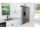 Well-lit kitchen boasts granite countertops, stainless steel appliances, and ample cabinet space at 1570 Childress Sw Dr, Atlanta, GA 30311
