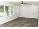 Bright living room with large windows, laminate floors and fresh paint at 1570 Childress Sw Dr, Atlanta, GA 30311