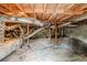 Unfinished basement with exposed wood beams, block foundation, and ductwork at 3436 Misty Valley Rd, Decatur, GA 30032