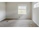 Neutral bedroom featuring a large window providing natural light and a cozy atmosphere at 3436 Misty Valley Rd, Decatur, GA 30032