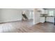 Open-concept living room with hardwood floors flowing into the dining area and kitchen at 3436 Misty Valley Rd, Decatur, GA 30032