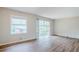 Bright living room with hardwood floors and large windows, offering plenty of natural light at 3436 Misty Valley Rd, Decatur, GA 30032