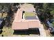 A high-angle view of a home showing its roof, yard, and adjacent outbuildings highlighting its ample space and potential at 5159 Covington Hwy, Decatur, GA 30035