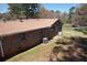 Exterior view of the home, showing a large lawn, and highlighting its serene setting at 5159 Covington Hwy, Decatur, GA 30035