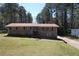 Traditional brick home with a well-manicured lawn, a inviting entrance with steps, and plenty of natural light at 5159 Covington Hwy, Decatur, GA 30035