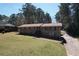 Traditional brick home with a well-manicured lawn, a inviting entrance with steps, and plenty of natural light at 5159 Covington Hwy, Decatur, GA 30035