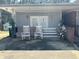 Relaxing back porch with outdoor seating, vintage details, and access ramp at 5169 Covington Hwy, Decatur, GA 30035