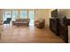 Bright and airy living room with beautiful hardwood floors, a fireplace, and large windows at 5169 Covington Hwy, Decatur, GA 30035