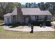 Charming stone-clad home with a cozy front patio and a well-maintained front yard at 5181 Covington Hwy, Decatur, GA 30035