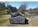 The rear of the home features a siding exterior and a modest yard, situated by a highway at 5181 Covington Hwy, Decatur, GA 30035