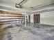 Unfinished basement with ample storage space, overhead lighting, and concrete flooring at 5470 Chanterella Sw Ct, Lilburn, GA 30047