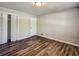 Bedroom has hardwood floors and closet at 5470 Chanterella Sw Ct, Lilburn, GA 30047