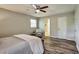 This bedroom features a ceiling fan and a window at 5470 Chanterella Sw Ct, Lilburn, GA 30047