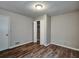 This bedroom features a ceiling light and a closet with paneled doors at 5470 Chanterella Sw Ct, Lilburn, GA 30047