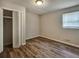 This bedroom features a ceiling light and a closet with paneled doors at 5470 Chanterella Sw Ct, Lilburn, GA 30047