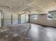 Spacious garage with multiple overhead doors, windows, and concrete flooring at 5470 Chanterella Sw Ct, Lilburn, GA 30047
