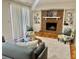 Cozy living room features a brick fireplace, built-in bookshelves, and comfortable seating at 5470 Chanterella Sw Ct, Lilburn, GA 30047