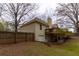 Fenced backyard featuring a two-story home, deck, and garage at 10 Flowers Dr, Covington, GA 30014